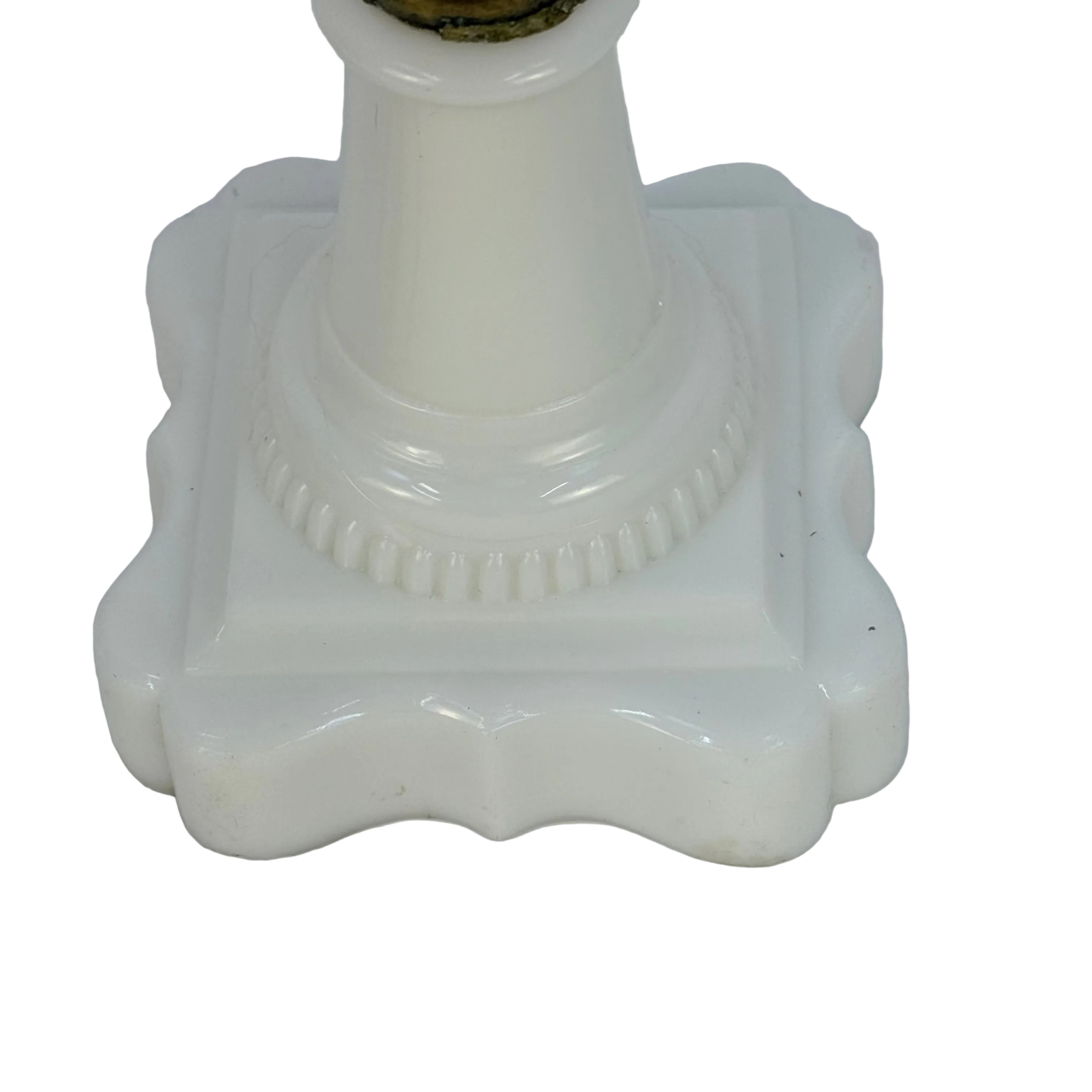 White ceramic candlestick holder on a white background