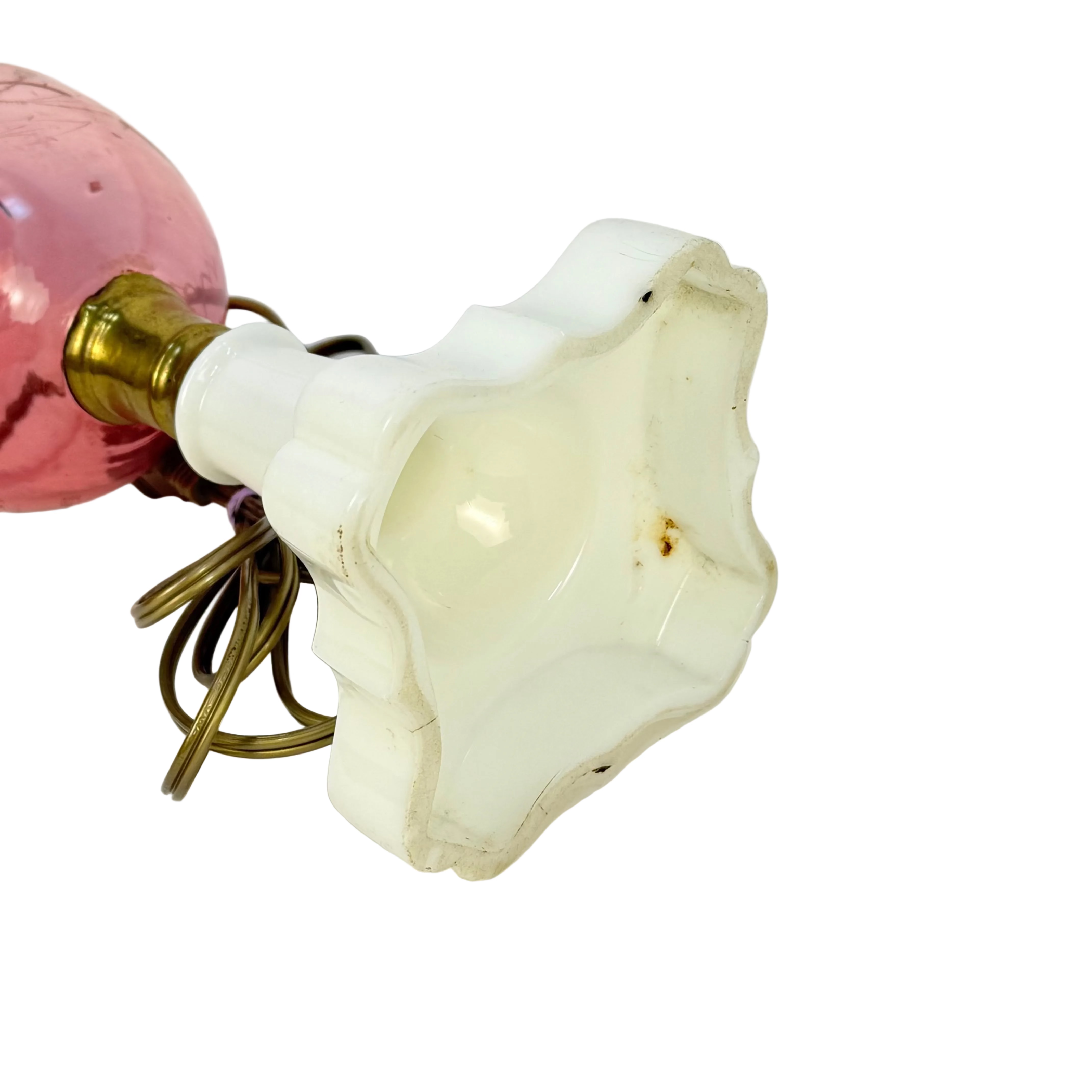 Vintage-style light bulb with decorative pink glass cover on a white background