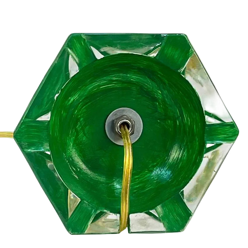 Green glass light fixture with hexagonal design on a white background