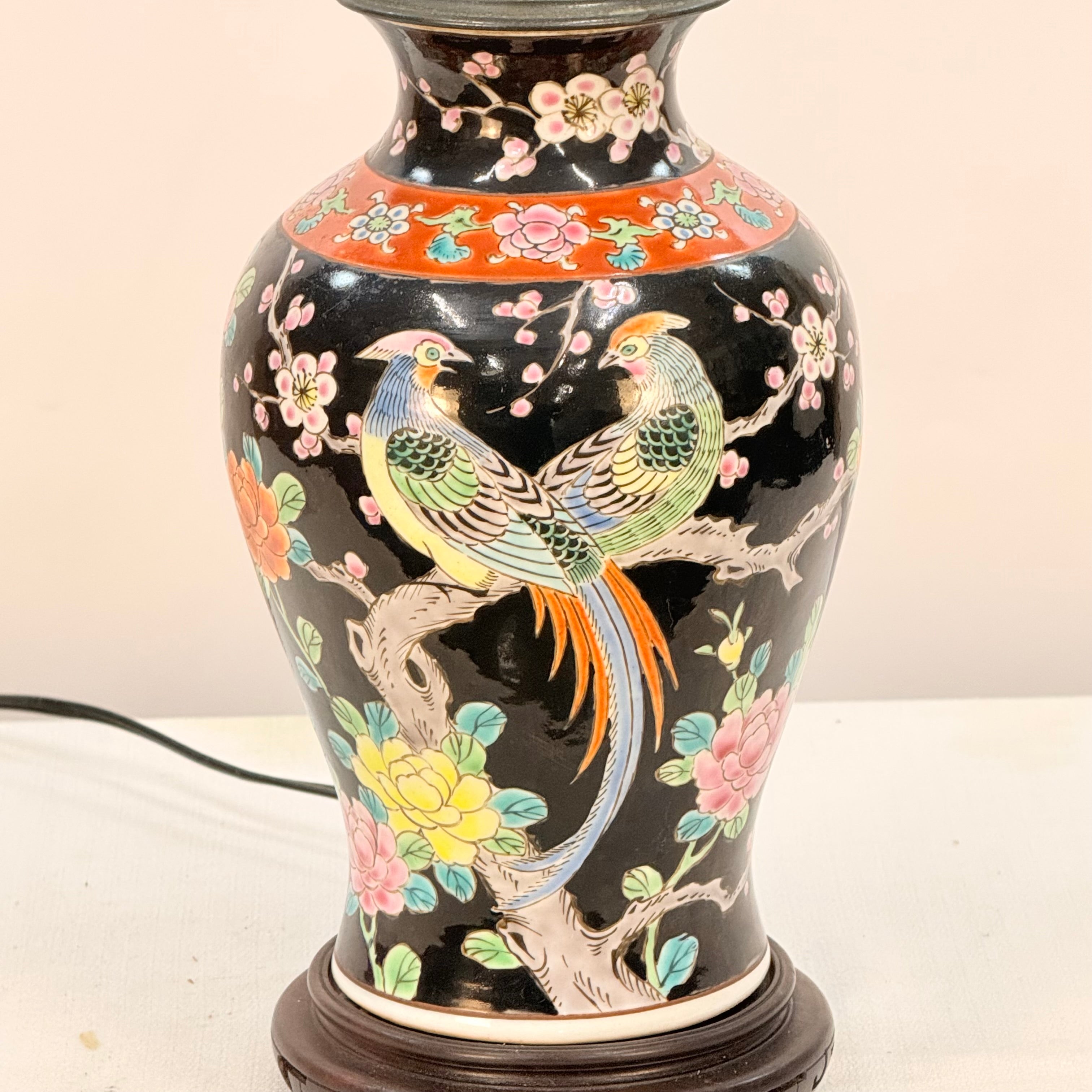 Decorative vase with bird and floral patterns on a white background