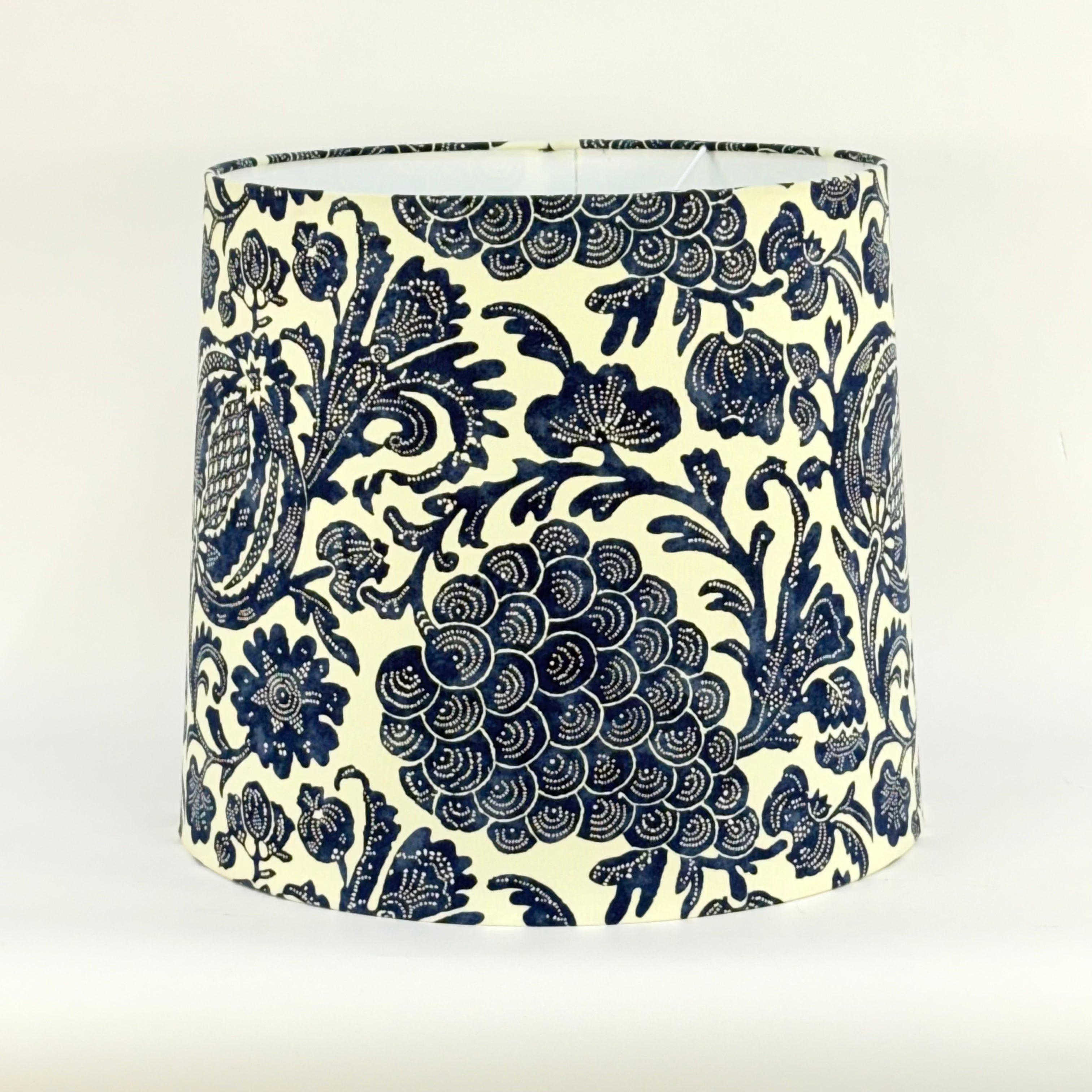 Decorative lampshade with blue floral pattern on a white background