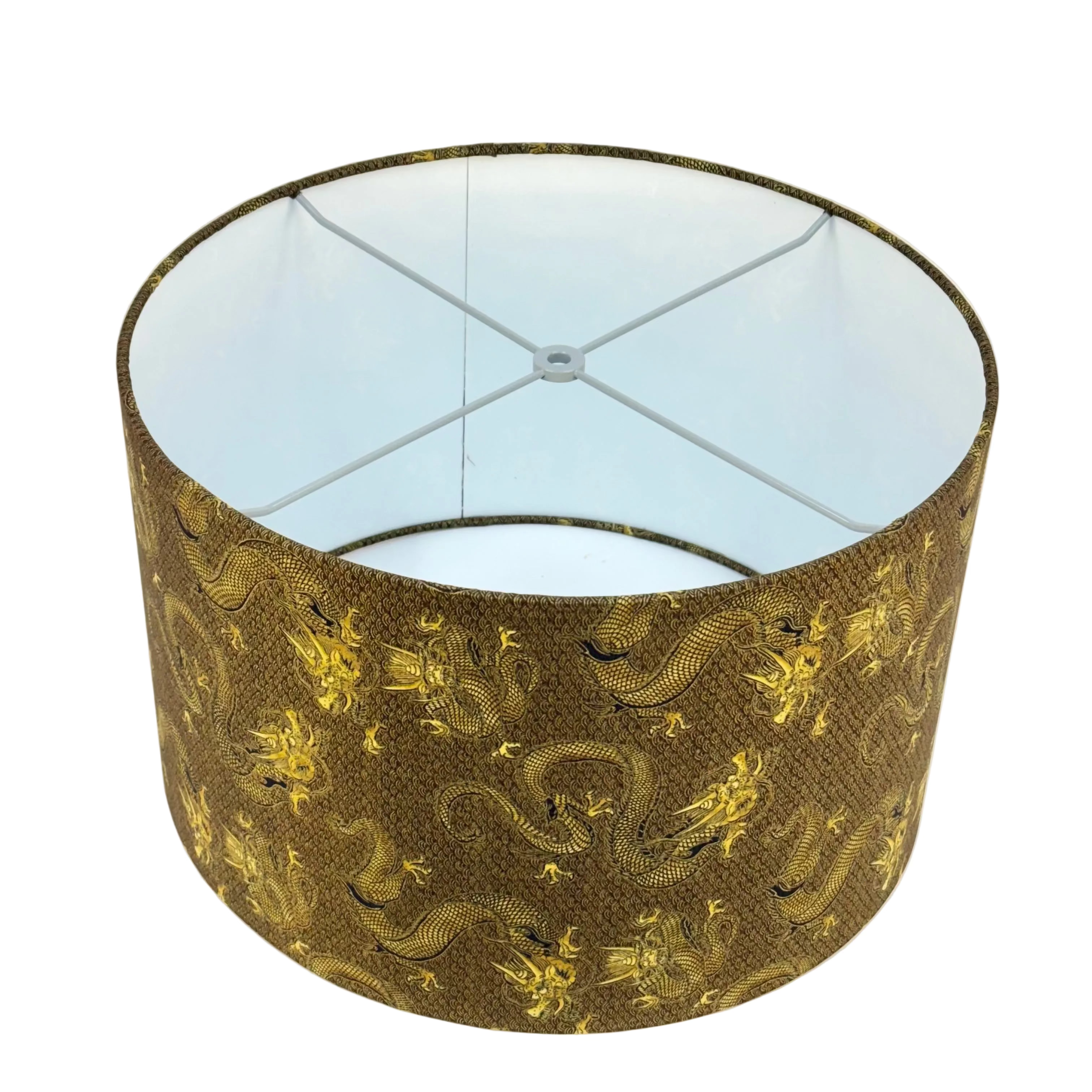Lampshade with gold dragon design on a white background