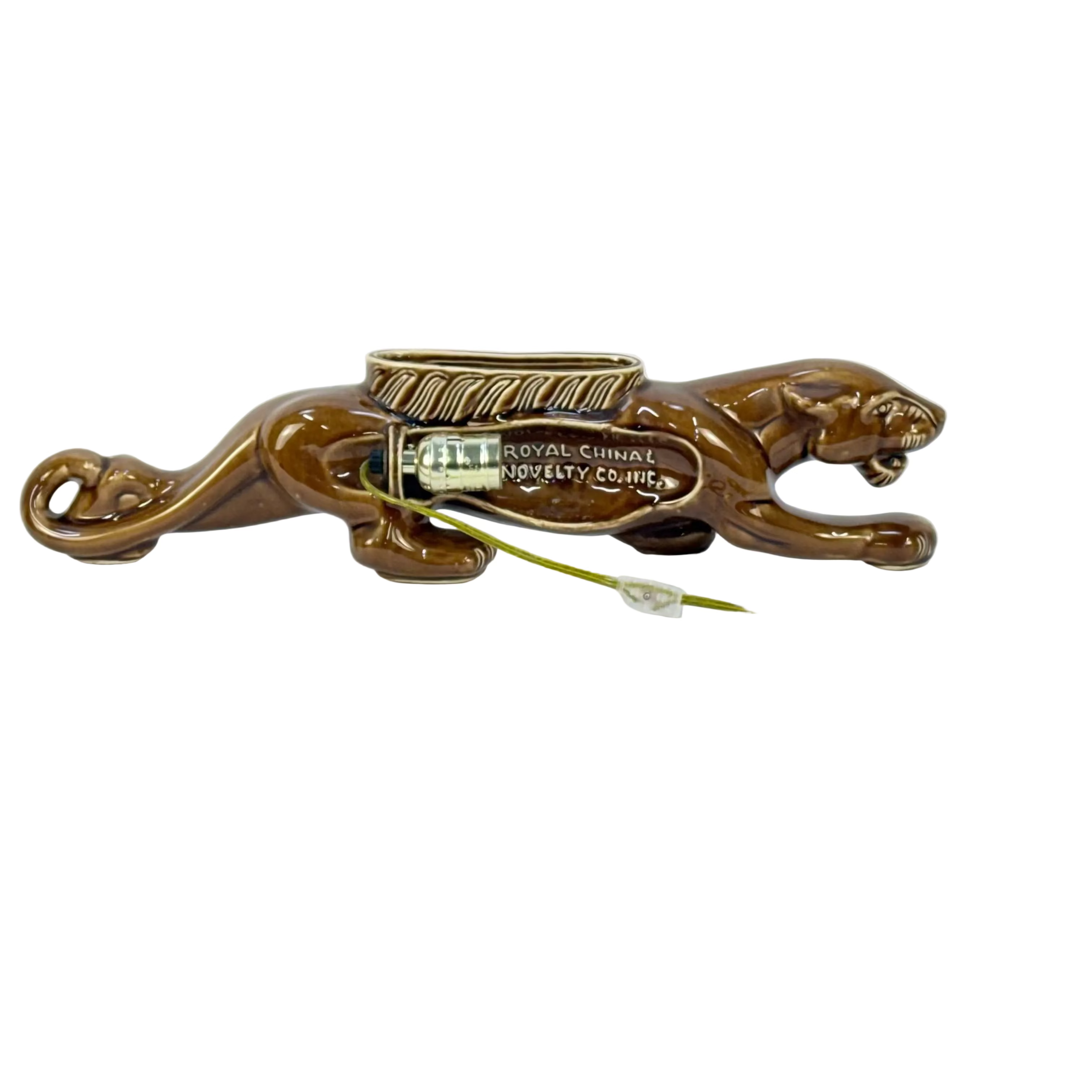 Bronze-colored panther-shaped object with a green cord on a white background