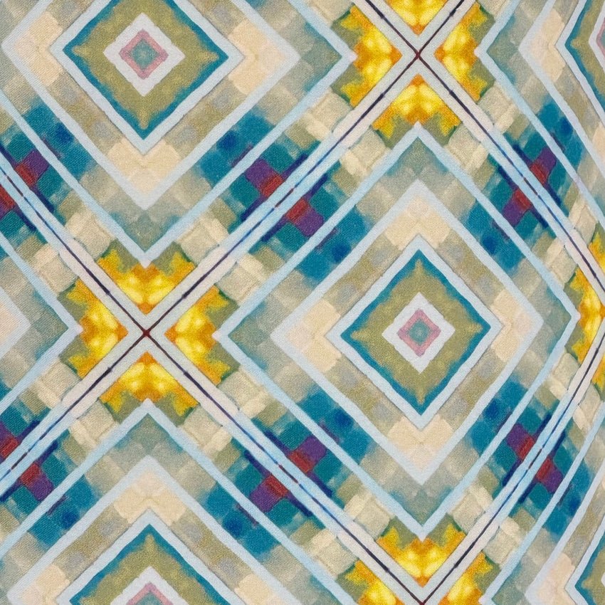 Geometric pattern with diamond shapes in various colors on a textured surface