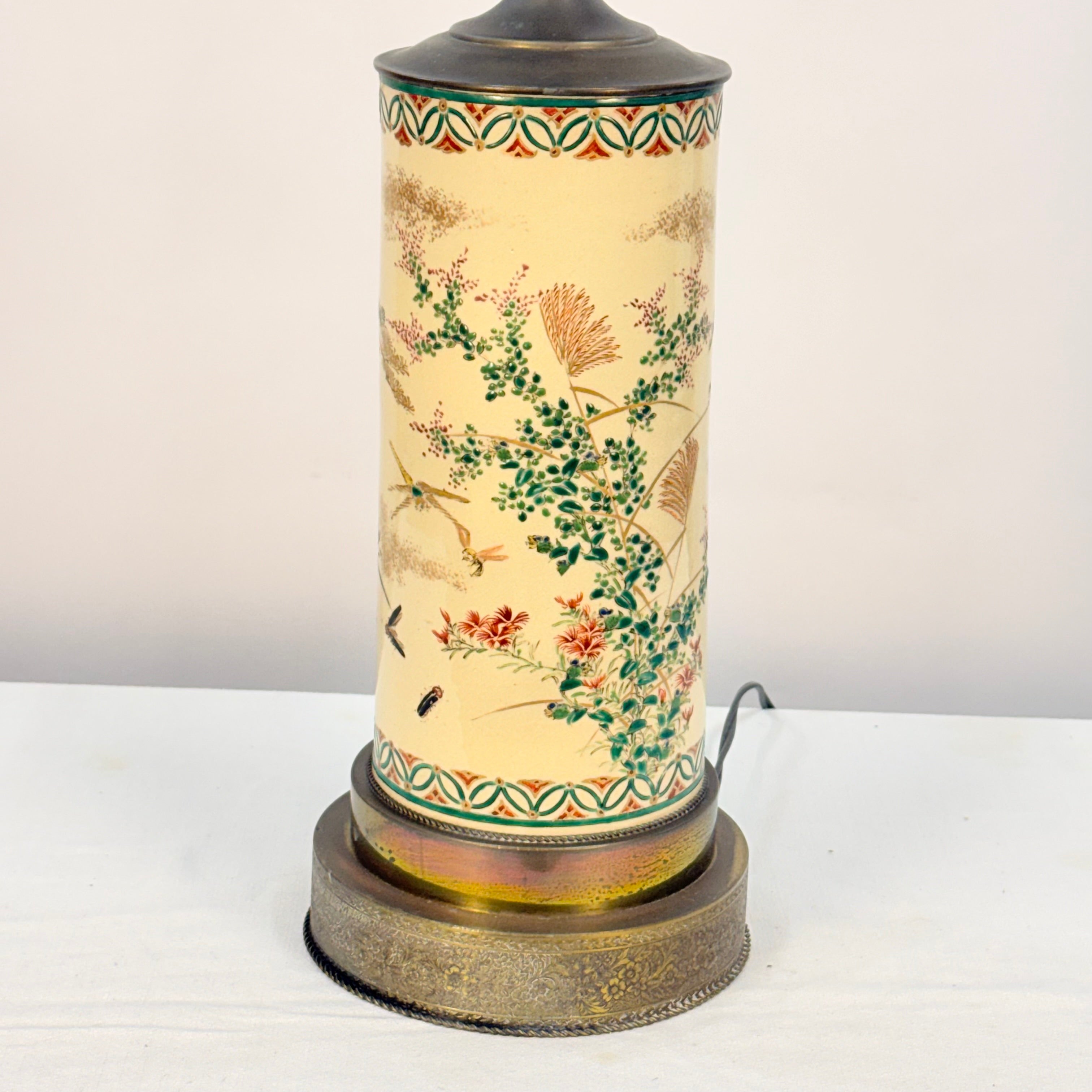 Decorative table lamp with floral patterns on a white background
