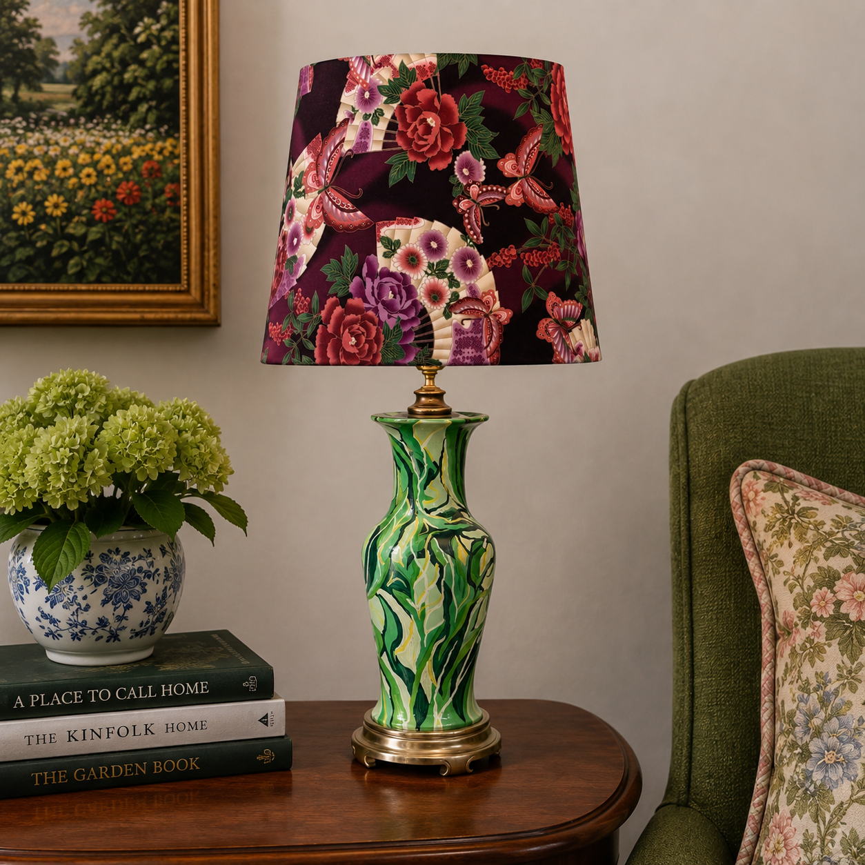 A decorative table lamp with a floral patterned drum shade and a glossy green and white marbled ceramic base, styled on a wooden side table in a living room setting.