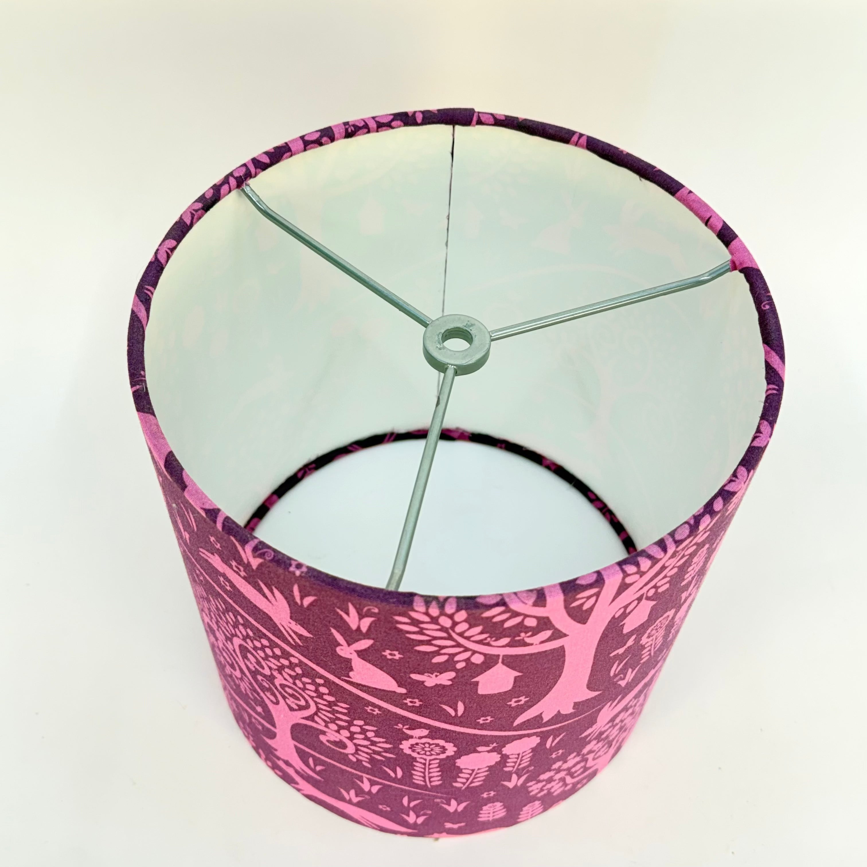 Lampshade with pink and white pattern on a white background