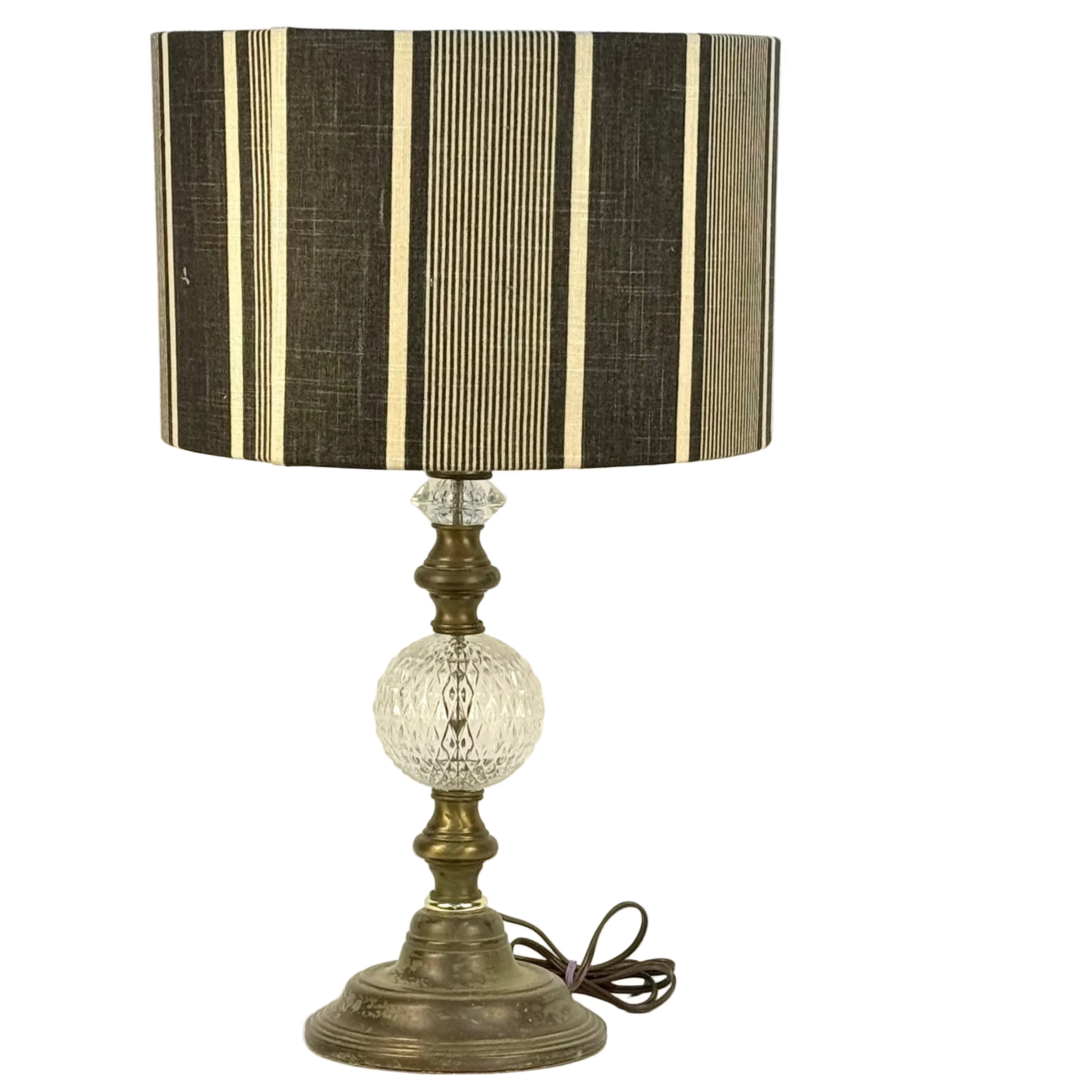 Table lamp with a striped shade on a white background