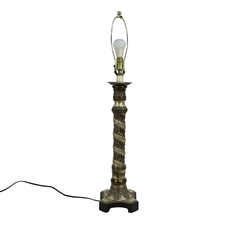 Decorative tall table lamp with intricate design on a white background