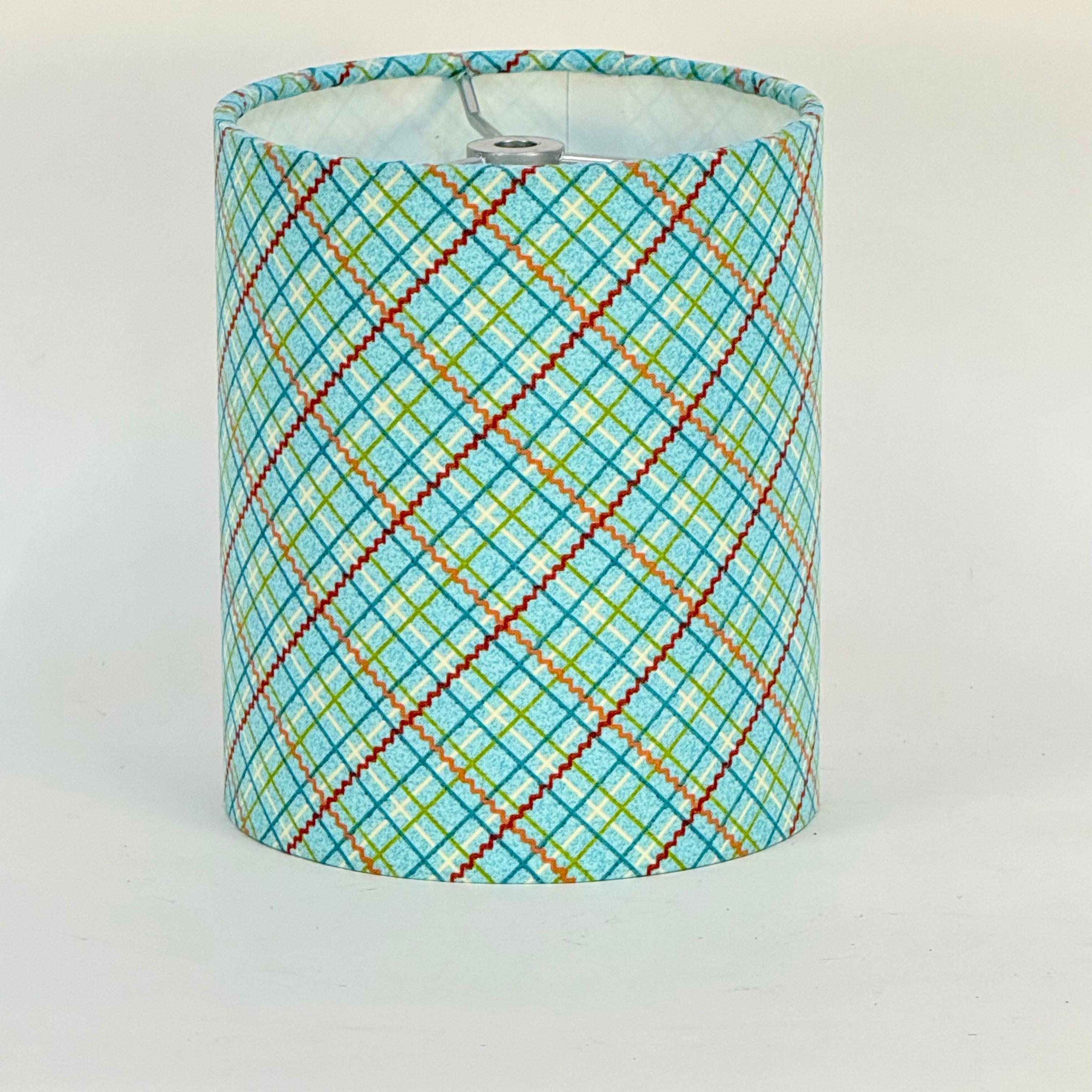 Lampshade with a colorful geometric pattern on a white background