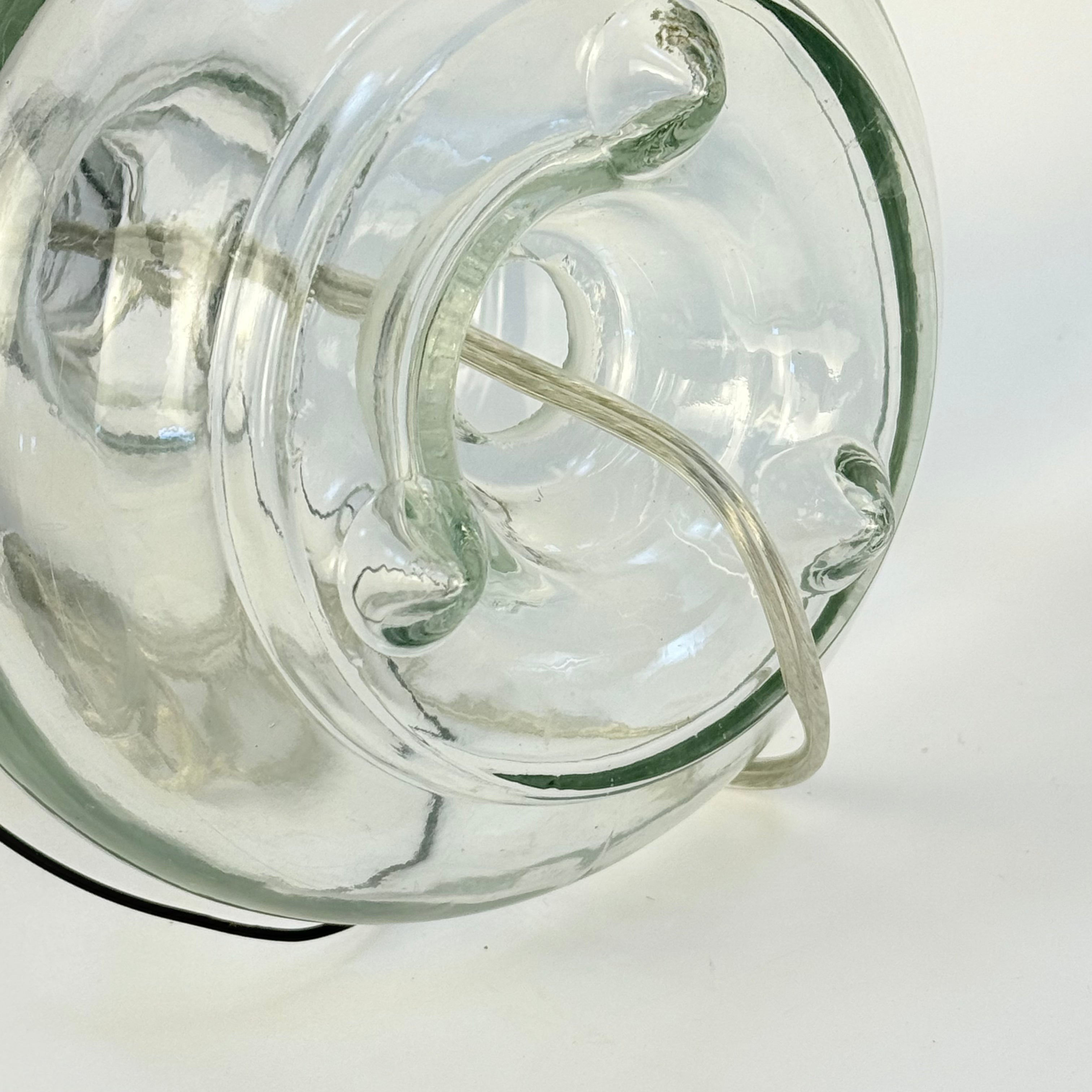 Clear glass light fixture on a white background