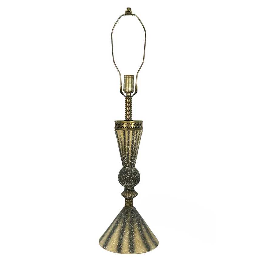 A decorative table lamp with a textured, metallic gold and bronze finish, featuring a flared base, a ribbed stem, and a wire shade holder on a plain white background.