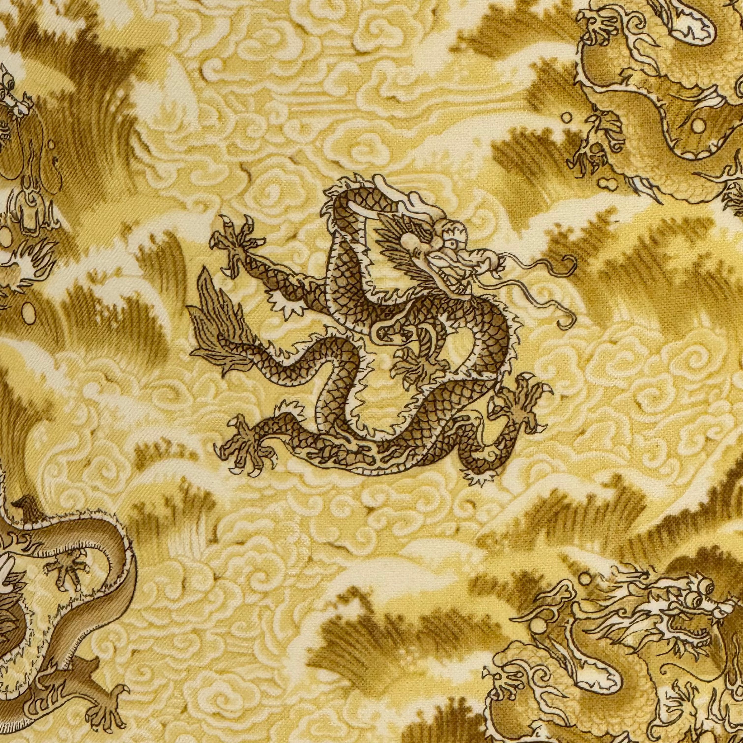 Patterned fabric with dragons and cloud designs on a yellow background