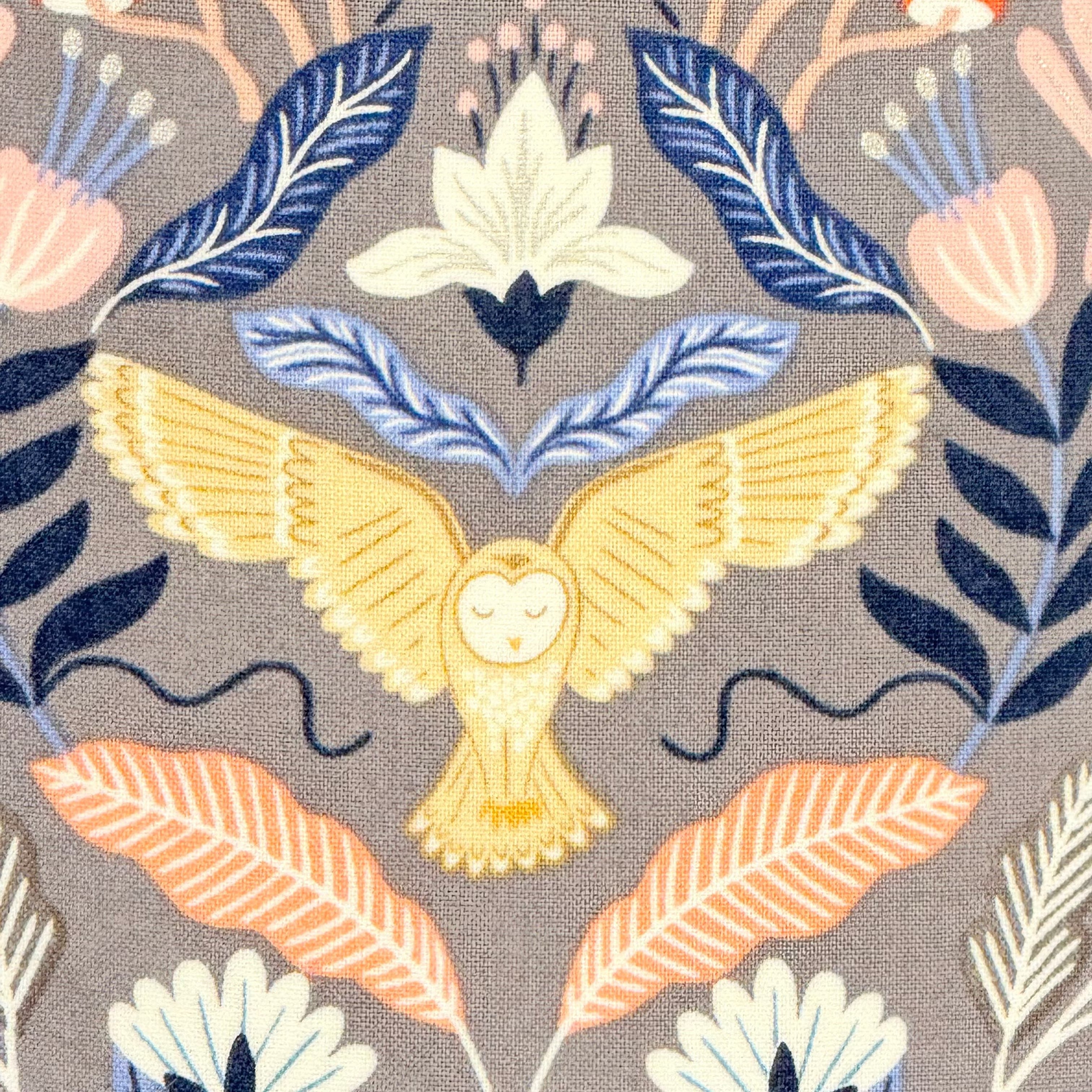 Fabric pattern with yellow owl, blue and orange leaves on a gray background