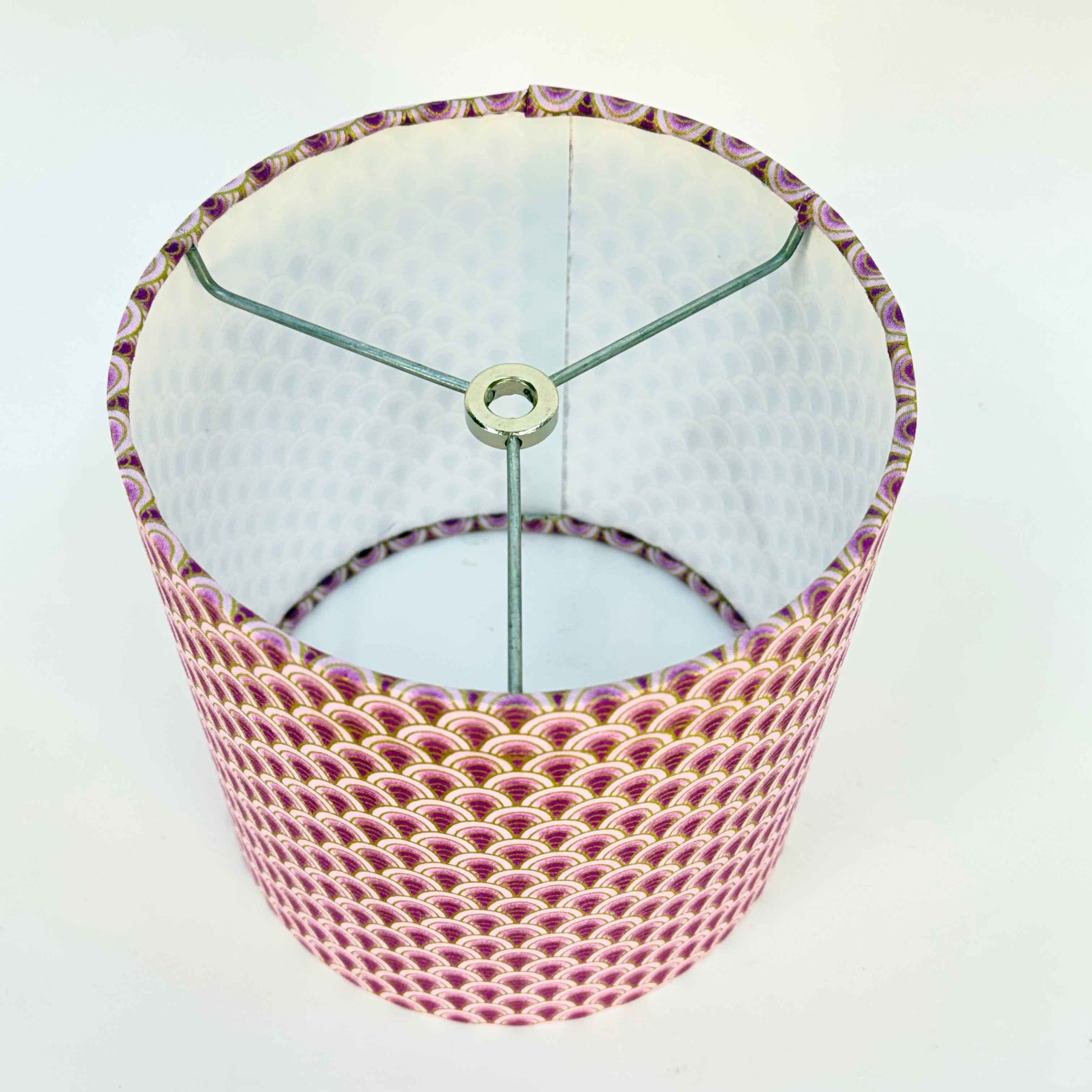 Lampshade with pink and purple pattern on a white background