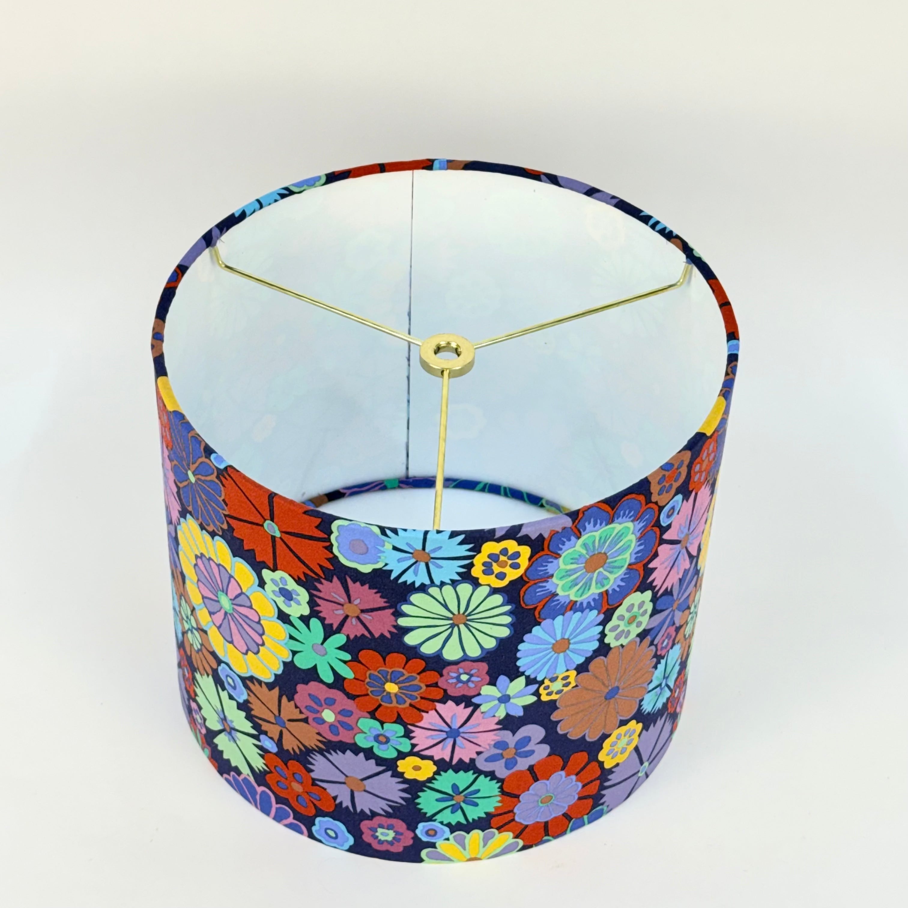 Colorful floral-patterned lampshade on a white background