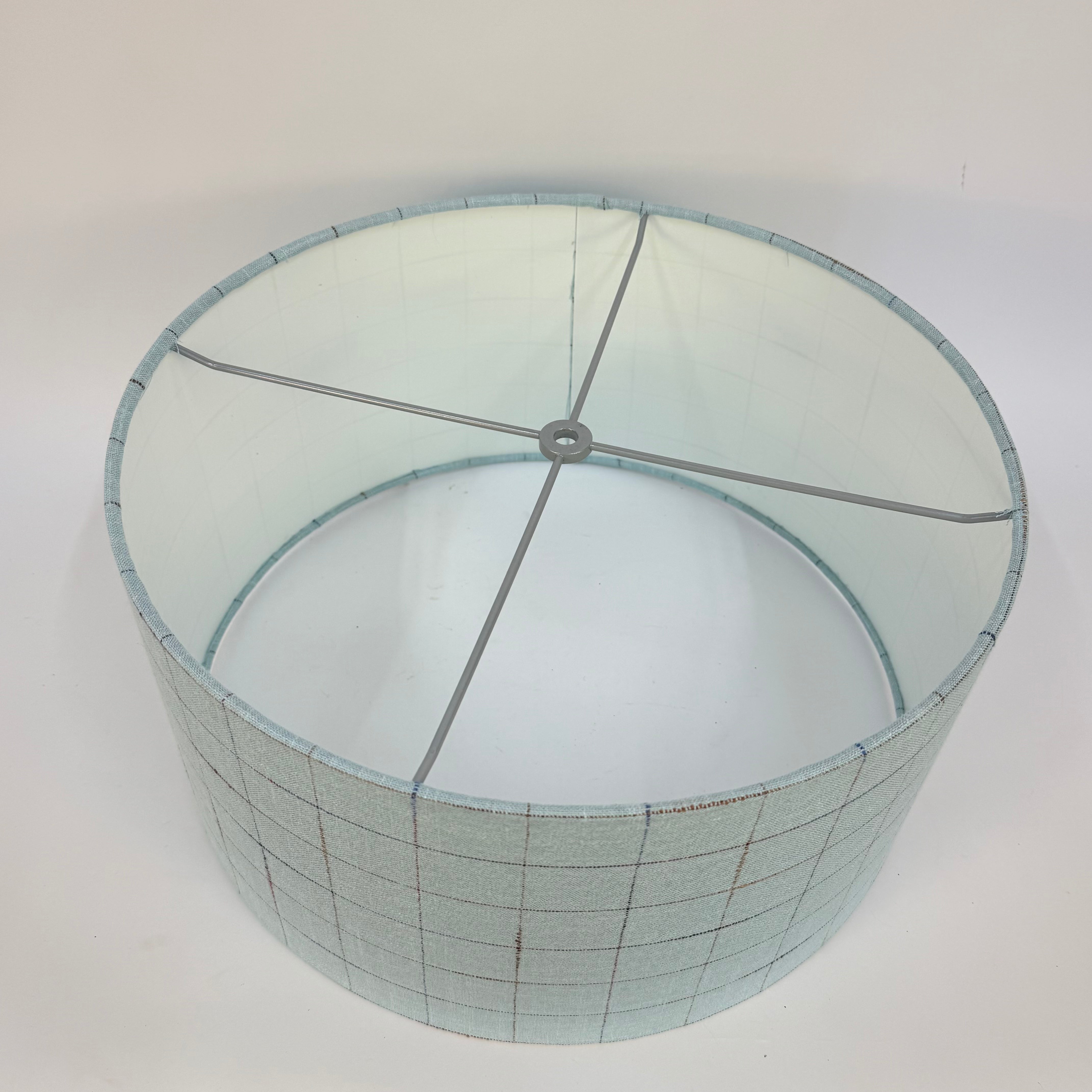 Lampshade with grid pattern on a white background